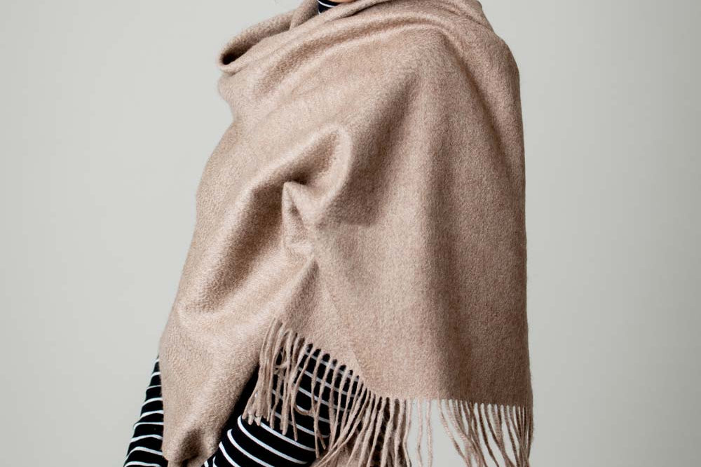 Model Wearing Alpine Cashmere Ripple Finish Wrap in Taupe