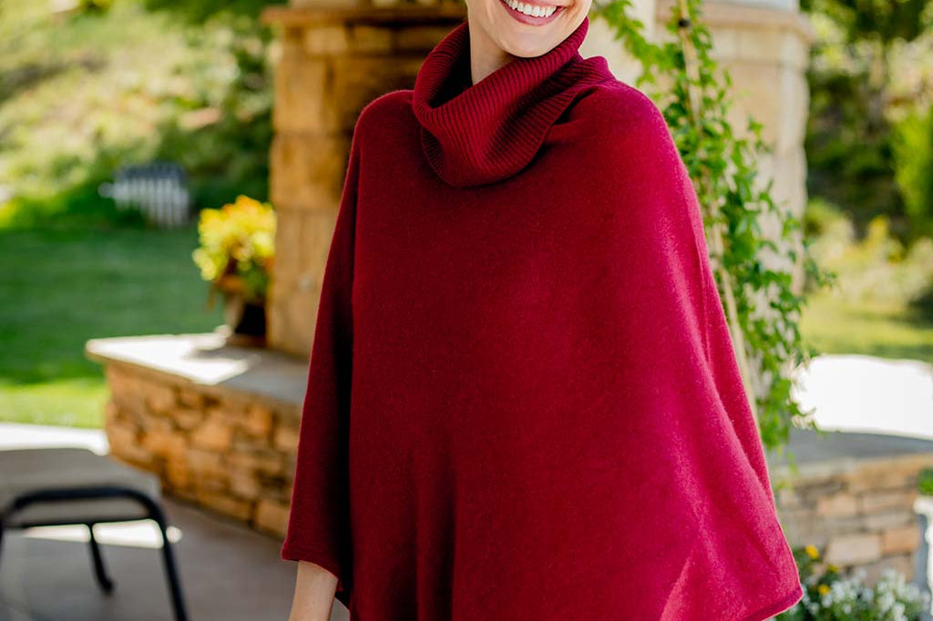 Model Wearing Alpine Cashmere Turtleneck Telluride Cashmere Poncho in Claret Red