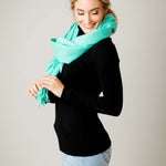 Model Wearing Alpine Cashmere Ripple Finish Wrap in Aqua 