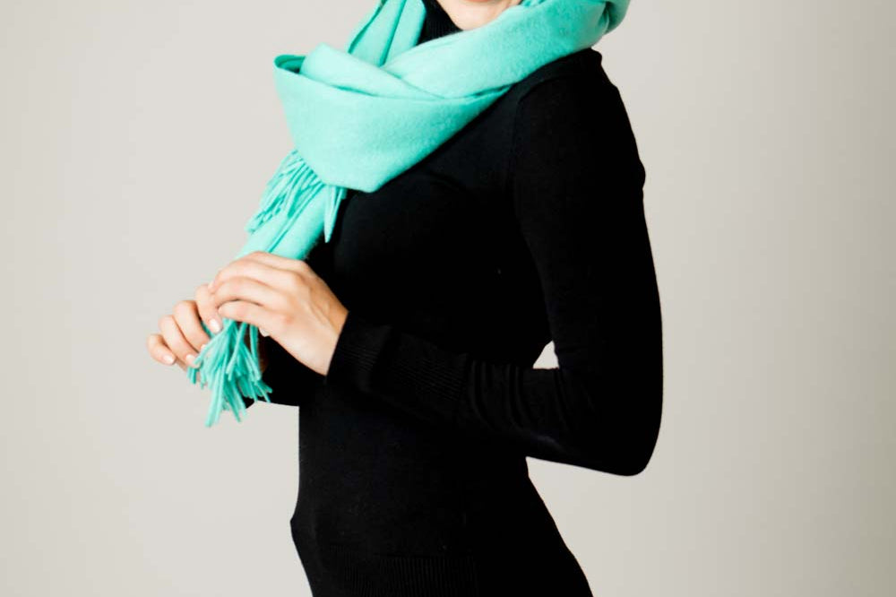 Model Wearing Alpine Cashmere Ripple Finish Wrap in Aqua 